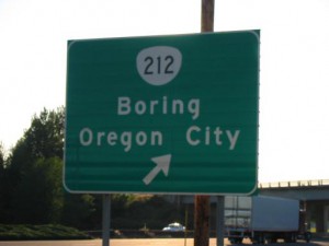 A highway exit sign listing the destinations Boring and Oregon City